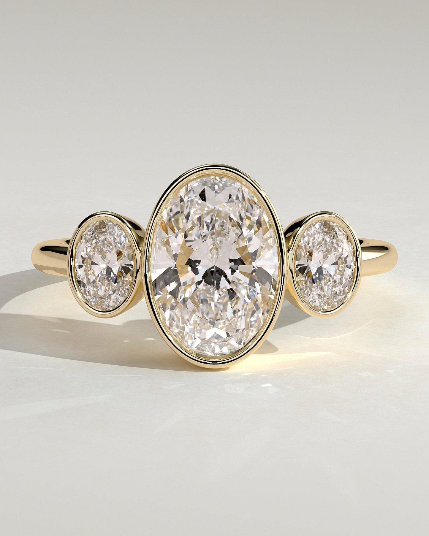 Oval Three Stones Bezel Lab Grown Diamond Engagement Ring
