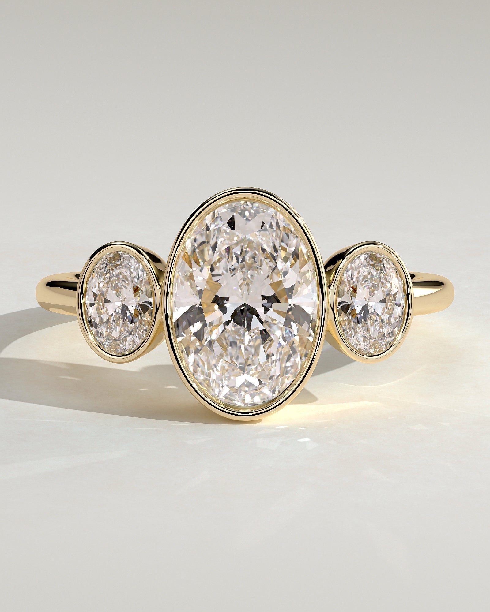 Oval Three Stones Bezel Lab Grown Diamond Engagement Ring